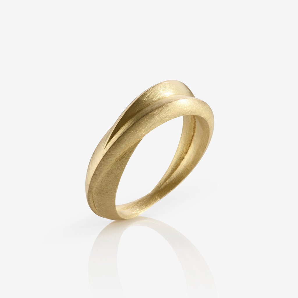 A chunky 18ct yellow gold ring with a matte finish, displayed against a white background. By contemporary jewellery designer, Sarah Straussberg