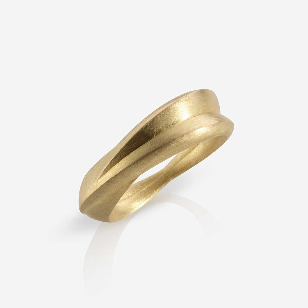 A chunky 18ct yellow gold ring with a matte finish, displayed against a white background. By contemporary jewellery designer, Sarah Straussberg