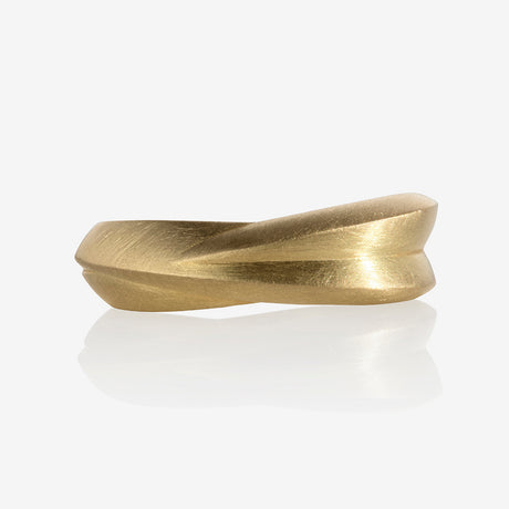 A chunky 18ct yellow gold ring with a matte finish, displayed against a white background. By contemporary jewellery designer, Sarah Straussberg
