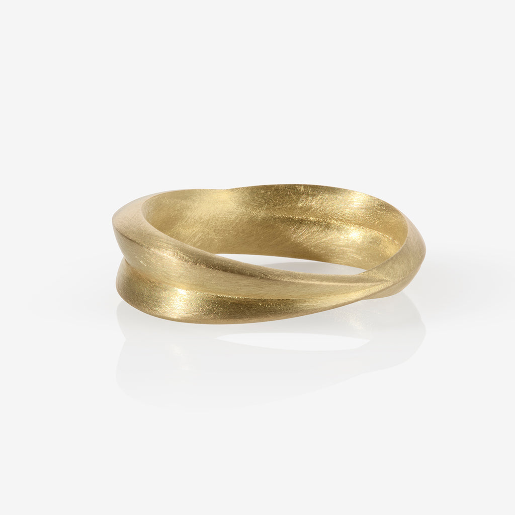 A chunky 18ct yellow gold ring with a matte finish, displayed against a white background. By contemporary jewellery designer, Sarah Straussberg