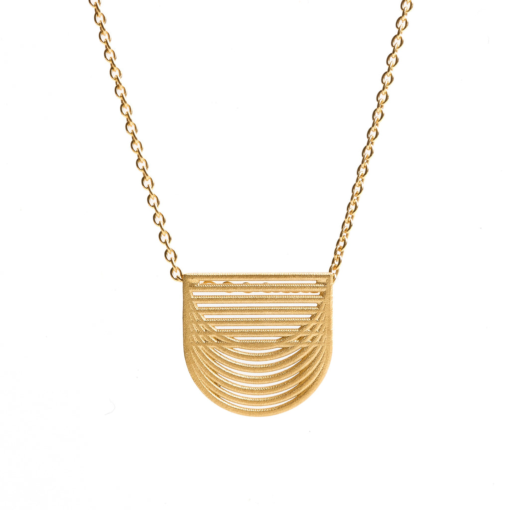 Gold plated pendant by contemporary jewellery designer, Sarah Straussberg