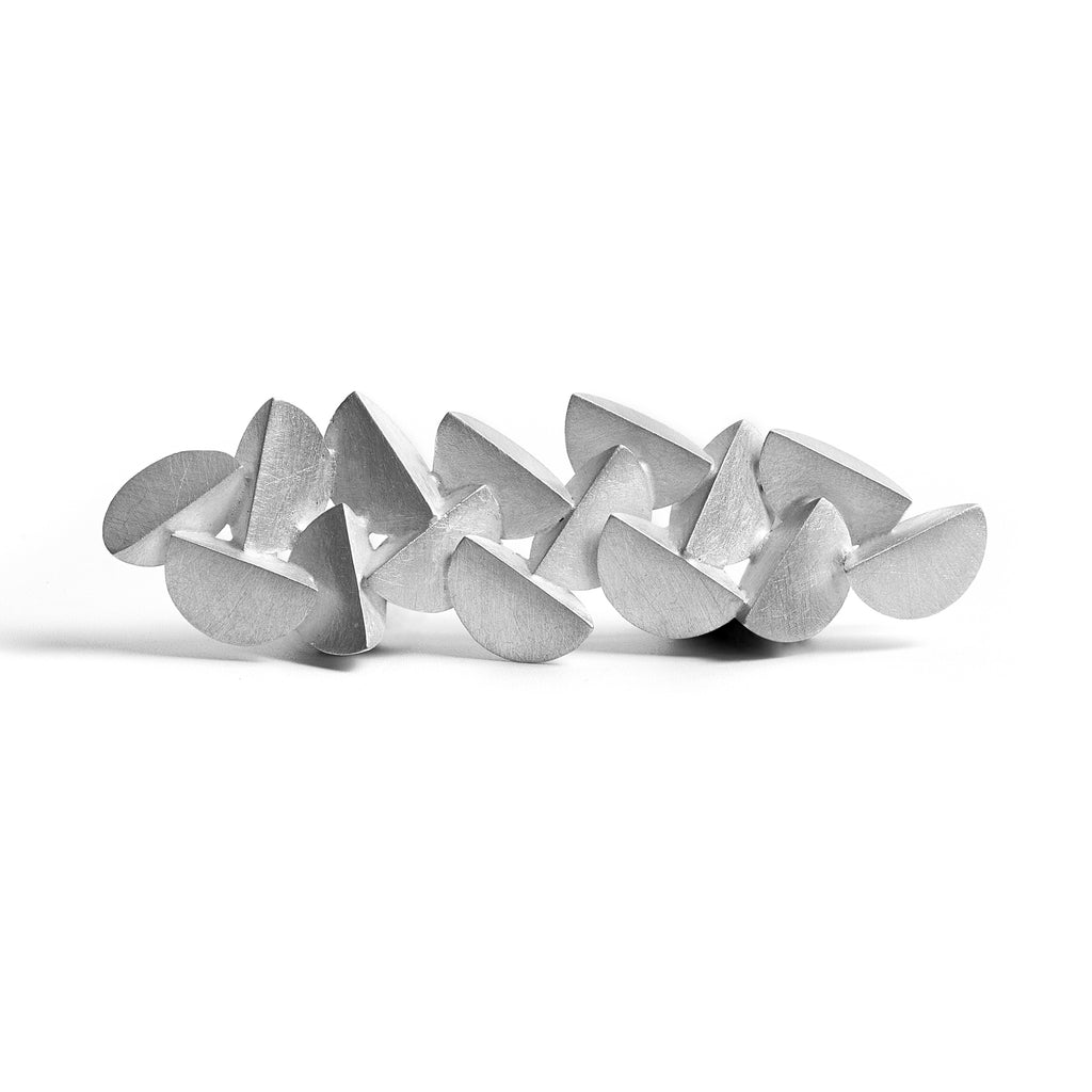 Modern sterling silver brooch by contemporary jewellery designer, Sarah Straussberg