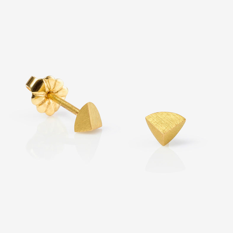 Simple matte gold stud earrings perfect for stacking by contemporary jewellery designer, Sarah Straussberg.