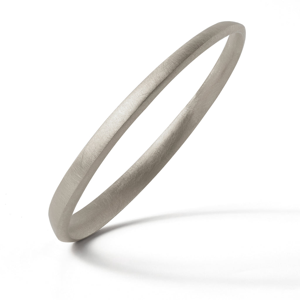 A sterling silver bangle from contemporary jewellery designer, Sarah Straussberg
