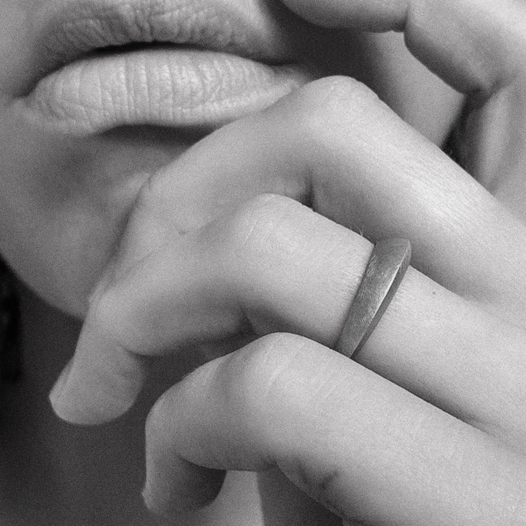 matte silver ring on hand model by contemporary jewellery designer, Sarah Straussberg