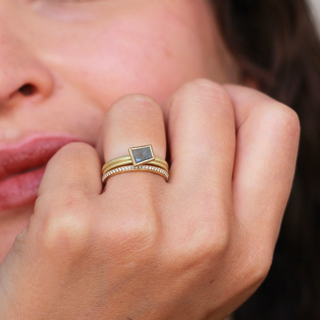 A salt and pepper diamond ring and eternity ring by contemporary jewellery designer, Sarah Straussberg