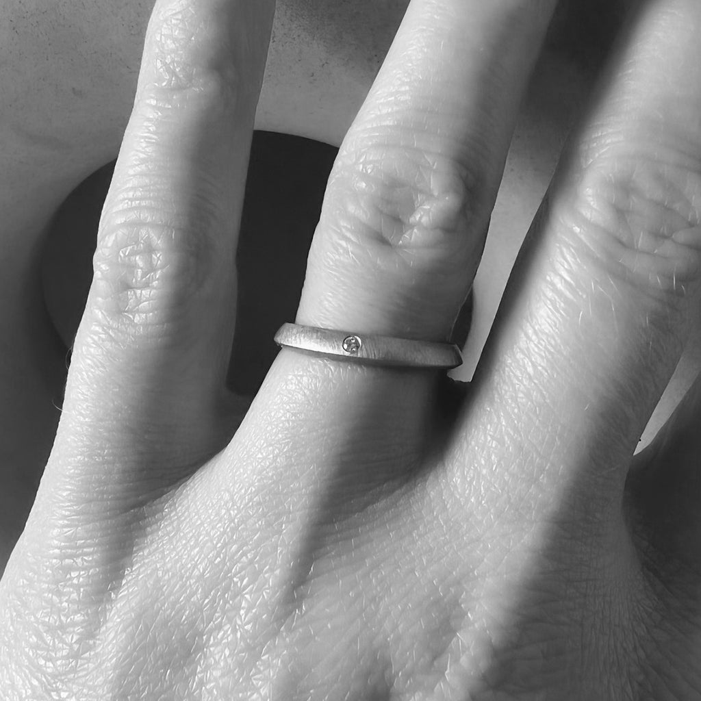 3mm diamond wedding ring on model by contemporary jewellery designer, Sarah Straussberg
