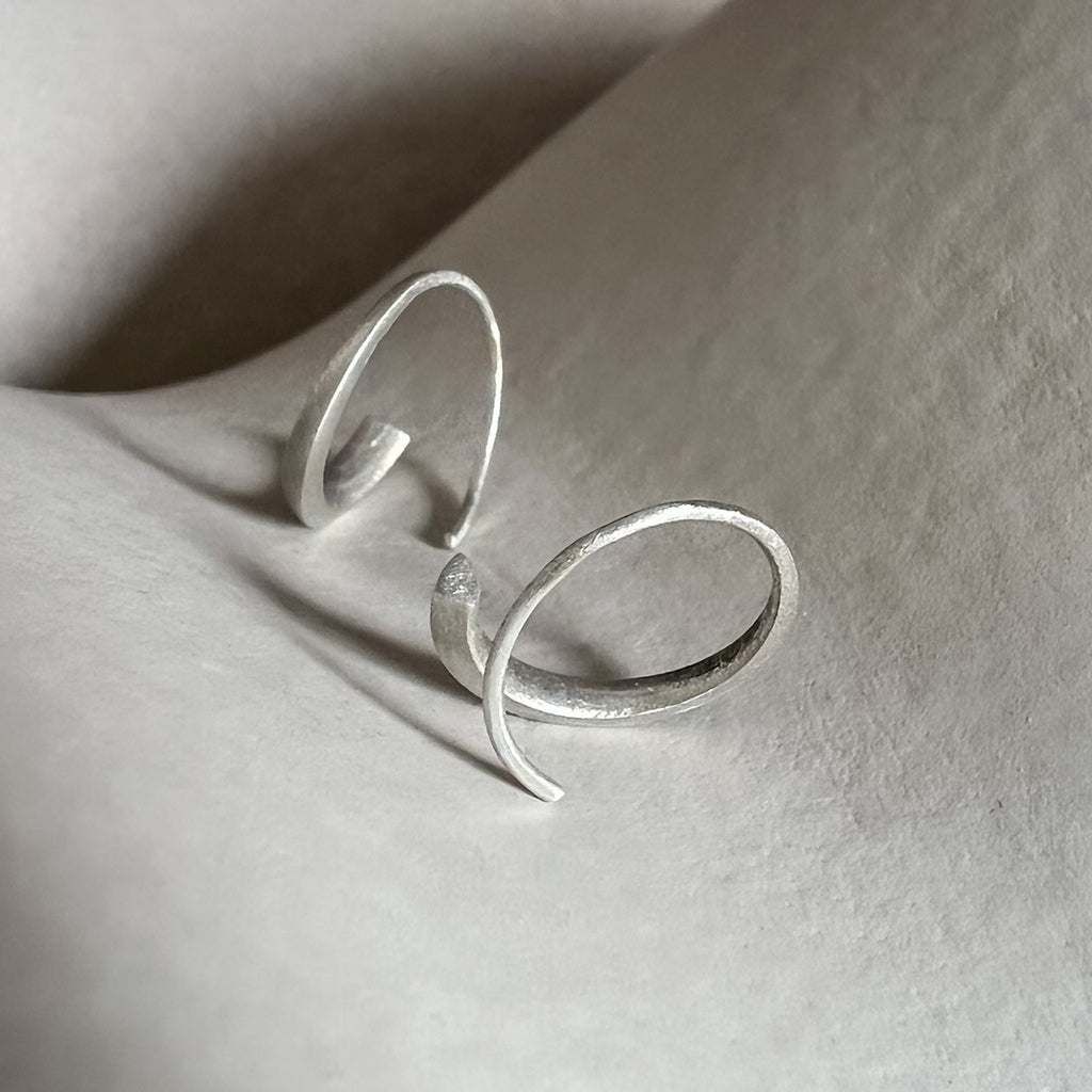White gold Signature Hoops by contemporary jewellery designer, Sarah Straussberg