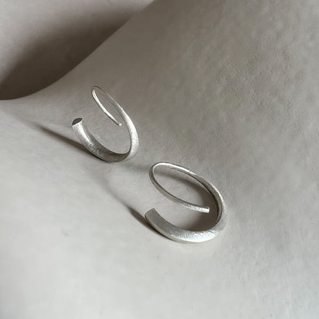 White gold Signature Hoops by contemporary jewellery designer, Sarah Straussberg