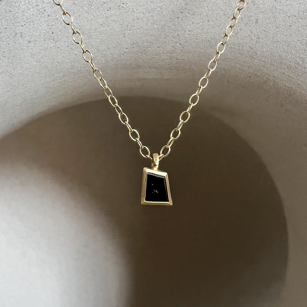 A salt and pepper diamond pendant by contemporary jewellery designer, Sarah Straussberg