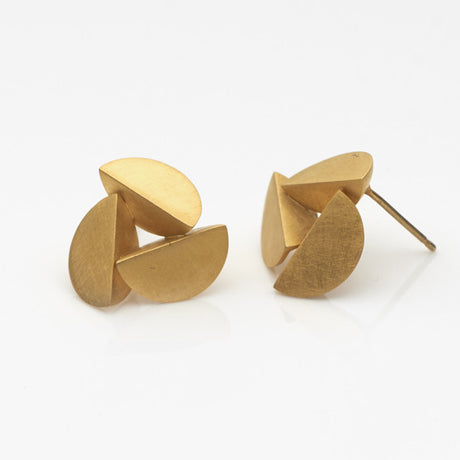 Sculptural gold plated earrings by contemporary jewellery designer, Sarah Straussberg