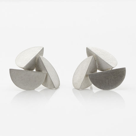 A pair of large-sized, sterling silver earrings with an abstract design by contemporary jewellery designer, Sarah Straussberg