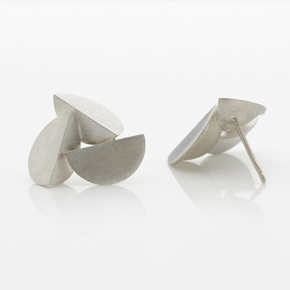 A pair of large-sized, sterling silver earrings with an abstract design by contemporary jewellery designer, Sarah Straussberg