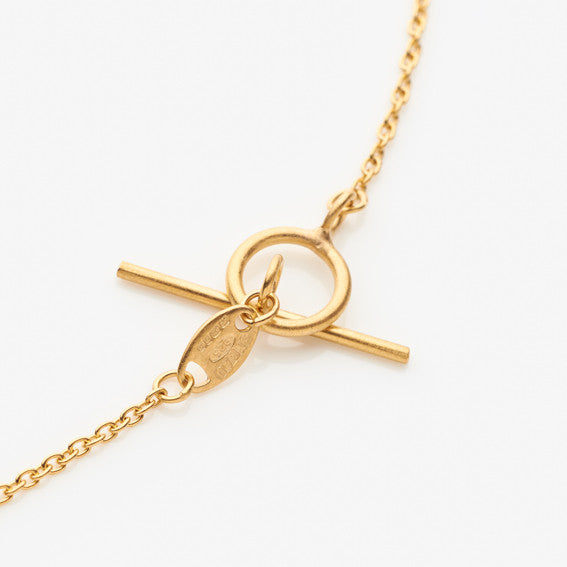 Gold plated t-bar clasp by contemporary jewellery designer, Sarah Straussberg